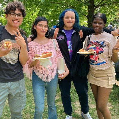 4 students eating at CCNY BBQ